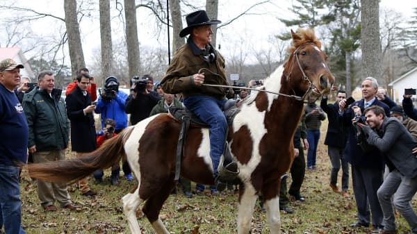 Republican candidate for U.S. Senate Judge Roy Moore rides his horse after voting in Gallant, Alabama, U.S., December 12, 2017.