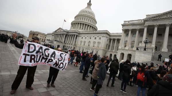 People protest in front of the U.S. Capitol to urge Congress to save the Deferred Action for Childhood Arrivals (DACA) program on December 6, 2017, in Washington, D.C.