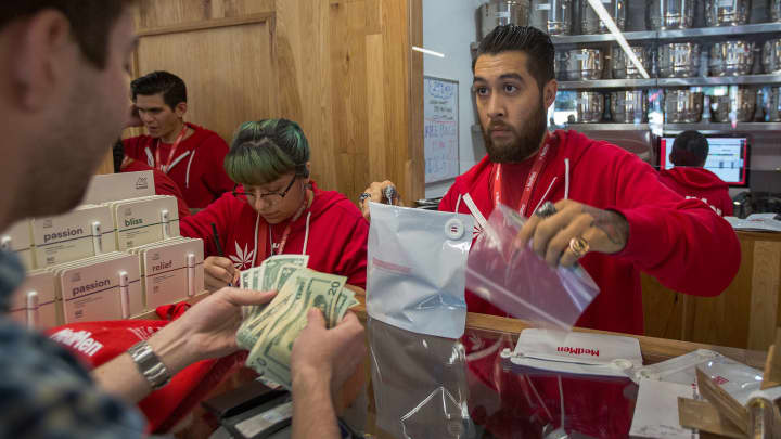A customer buys cannabis products at MedMen, one of the two Los Angeles area pot shops that began selling marijuana for recreational use under the new California marijuana law today, on January 2, 2018 in West Hollywood, California. Los Angeles and other nearby cities outside of West Hollywood have not finalized their local permitting rules so licenses to businesses in those jurisdictions are yet to be granted.