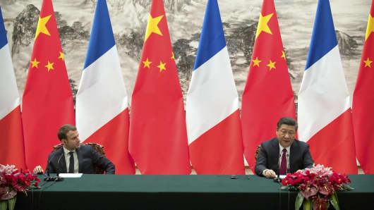 French President Emmanuel Macron and Chinese President Xi Jinping during a joint press briefing at the Great Hall of the People on January 9, 2018 in Beijing, China.