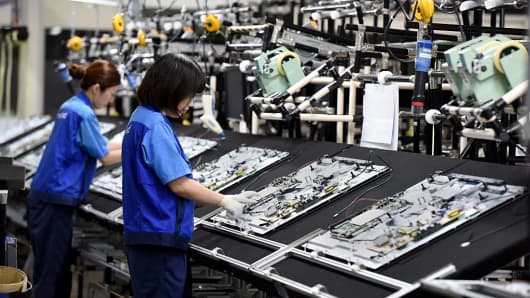 Workers assembling the Panasonic LCD 4K at the Utsunomiya plant in Japan on September 21, 2016.