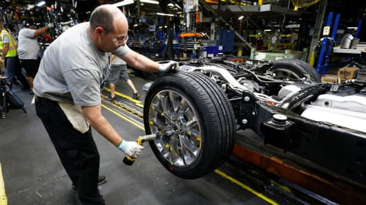 A worker builds the all-new 2018 Ford Expedition SUV as it goes through the assembly line at the Ford Kentucky Truck Plant October 27, 2017 in Louisville, Kentucky.