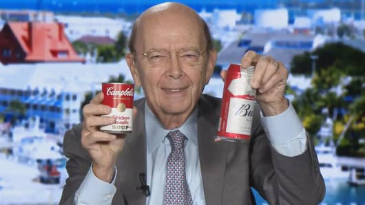 Commerce Secretary Wilbur Ross holds up a Campbell's Soup and Budweiser cans commenting on the US aluminum and steel tariff trade policy.