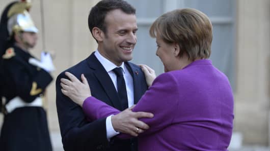 French President Emmanuel Macron receives German Chancellor Angela Merkel at Elysee Palace on March 16, 2018 in Paris, France.