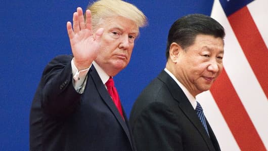 U.S. President Donald Trump and China's President Xi Jinping leave a business leaders event at the Great Hall of the People in Beijing on November 9, 2017.