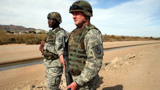 File photo of National Guardsmen watching the Mexico border.