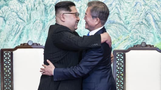 South Korean president, Moon Jae-in (R) and North Korean leader Kim Jong-un (L) are hugging after issuing a joint statement in the Peace House building at the southern side of the truce village of Panmunjom, South Korea on April 27, 2018.