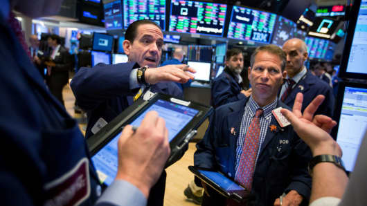 Traders work the floor at the NYSE in New York.