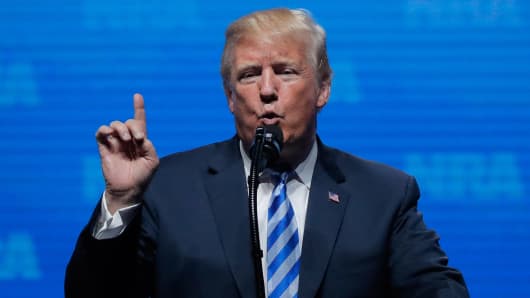 President Donald Trump gestures before he speaks at a National Rifle Association (NRA) convention in Dallas, Texas, U.S. May 4, 2018.