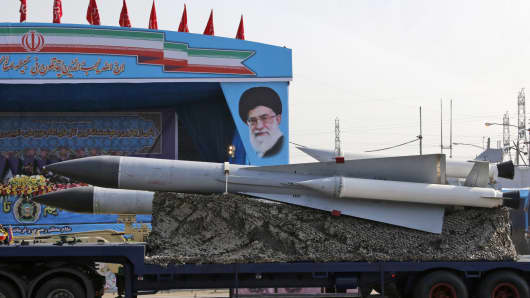 An Iranian military truck carries surface-to-air missiles past a portrait of Iran's Supreme Leader Ayatollah Ali Khamenei during a parade on the occasion of the country's annual army day on April 18, 2018, in Tehran.