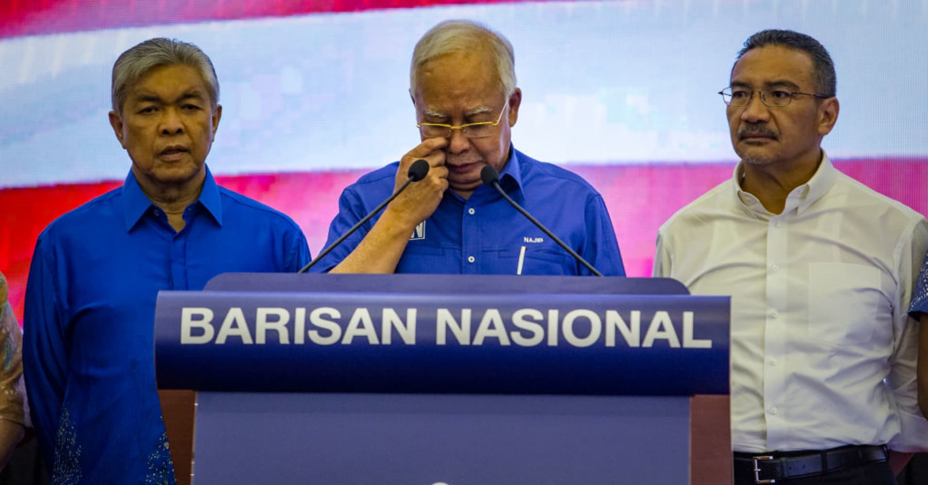 Ousted Malaysian chief Najib Razak quits as chief of occasion, barred from leaving nation