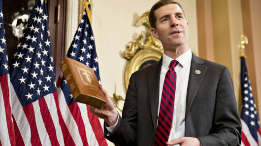 Conor Lamb, a Democrat from Pennsylvania, shows a copy of the Bible to members of the media in the speakers ceremonial room before a mock swearing-in with U.S. House Speaker Paul Ryan, a Republican from Wisconsin, not pictured, at the U.S. Capitol in Washington, D.C., Thursday, April 12, 2018.