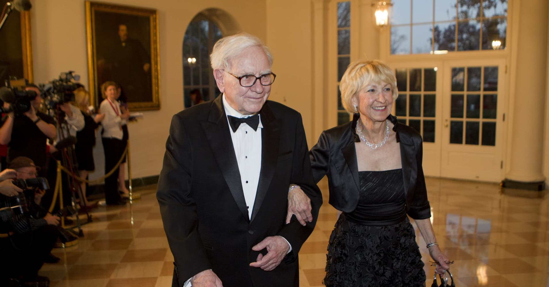Warren Buffett and his wife Astrid Buffett arrive to a state dinner hosted by U.S. President Barack Obama and first lady Michelle Obam at the White House in Washington, D.C., U.S., on Wednesday, March 14, 2012.