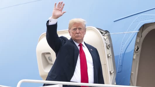 President Donald Trump waves while boarding Air Force One at Joint Base Andrews, Maryland, on Thursday, May 31, 2018.