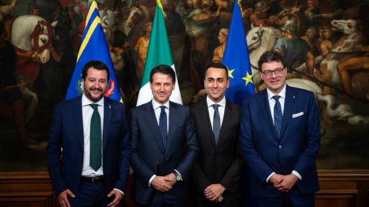 Matteo Salvini (L), Deputy Prime Minister and Italian Interior minister, Italian Prime Minister Giuseppe Conte (2L), Luigi Di Maio (2R), Deputy Prime Minister and Labor Minister, and Giancarlo Giorgetti (R) Undersecretary pose for a picture during the first cabinet meeting of the new government at the Palazzo Chigi on June 1, 2018 in Rome.