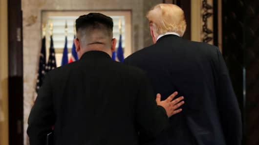 President Donald Trump and North Korea's leader Kim Jong Un leave after signing documents that acknowledge the progress of the talks and pledge to keep momentum going, after their summit at the Capella Hotel on Sentosa island in Singapore June 12, 2018.