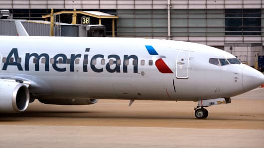 An American Airlines Boeing 737 passenger plane taxis from a gate to the runway at Ronald Reagan Washington National Airport in Washington, D.C.