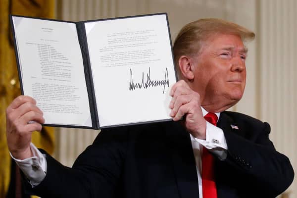 President Donald Trump displays his signature after signing a national space policy directive during a meeting of the National Space Council in the East Room of the White House in Washington, U.S., June 18, 2018.