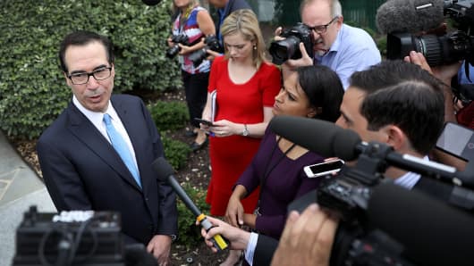 Treasury Secretary Steven Mnuchin answers questions from the media outside the White House June 27, 2018 in Washington, DC.