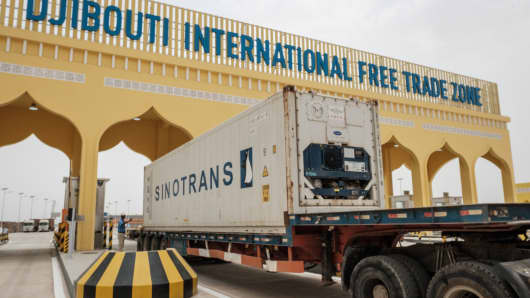 A container truck passes the main gate of Djibouti International Free Trade Zone after an inauguration ceremony in Djibouti on July 5, 2018.