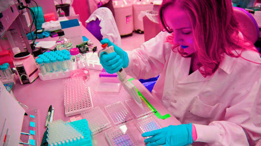 A research technician prepares human cell samples for vaccine studies in the vaccine research laboratory at the Mayo Clinic medical center in Rochester, Minnesota.
