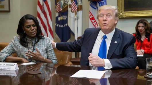 President Donald Trump holds an African American History Month listening session attended by Director of Communications for the Office of Public Liaison Omarosa Manigault (L) and other officials in the Roosevelt Room of the White House on February 1, 2017 in Washington, DC.