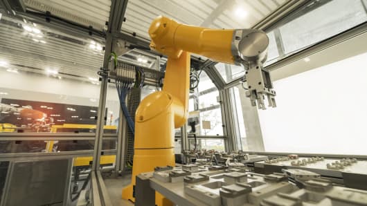 A robotic arm at an industrial manufacturing factory. 