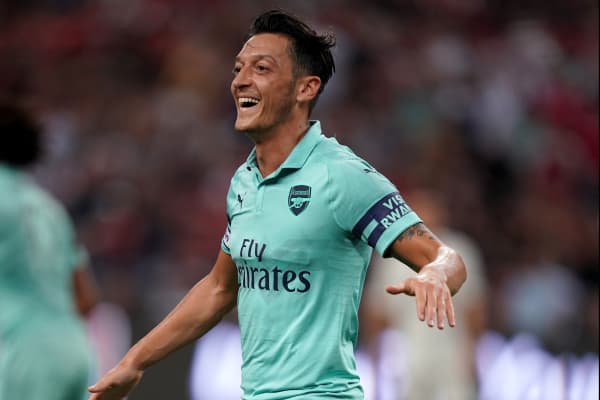 Â Mesut Ozil of Arsenal celebrates after scoring their 1st goal during the International Champions Cup match between Arsenal and Paris Saint Germain at the National Stadium on July 28, 2018 in Singapore.Â 