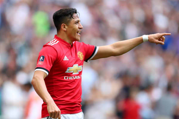 Alexis Sanchez of Manchester United celebrates after scoring his sides first goal during The Emirates FA Cup Semi Final match between Manchester United and Tottenham Hotspur at Wembley Stadium on April 21, 2018 in London, England.Â 