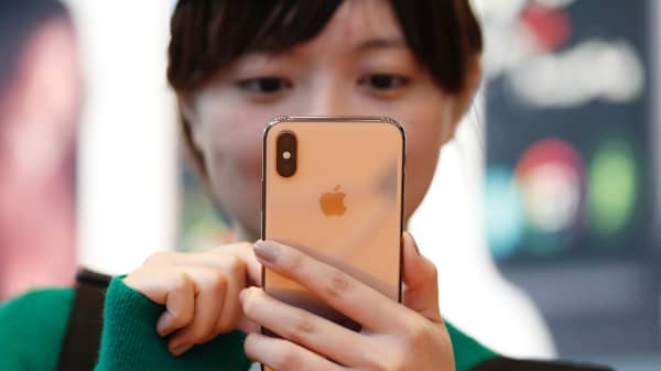 A customer looks at Apple's new iPhone XS after it went on sale at the Apple Store in Tokyo, Japan, September 21, 2018.