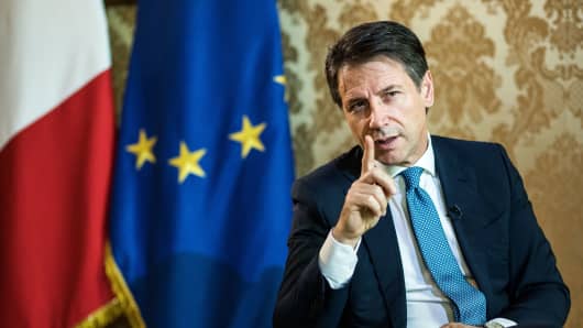 Giuseppe Conte, Italy's prime minister, gestures as he speaks during an interview at Chigi palace in Rome, Italy, on Tuesday, Oct. 23, 2018. 