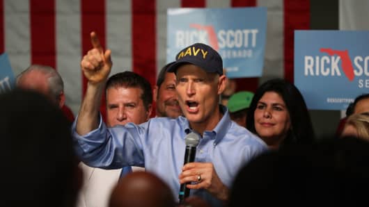 Florida Governor Rick Scott addresses supporters as he holds a Senate campaign rally at the Interstate Beverage Corp. on April 10, 2018 in Hialeah, Florida. 