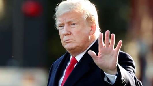 President Donald Trump waves prior to departing on a trip to Wisconsin from the White House in Washington, October 24, 2018.