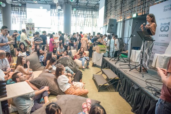 An audience listens to one of a series of talks at Green Is The New Black's annual festival in Singapore in October 2017.