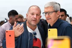 Apple chief design officer Jony Ive and Apple CEO Tim Cook inspect iPhone XR.