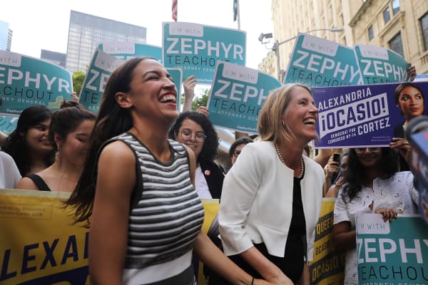 Alexandria Ocasio-Cortez (L) stands with Zephyr Teachout after endorsing her for New York City Public Advocate on July 12, 2018 in New York City. The two liberal candidates held the news conference in front of the Wall Street bull in a show of standing up to corporate money. Ocasio-Cortez shocked the Democratic political community recently after an upset win against Representative Joe Crowley in the New York Democratic primary.