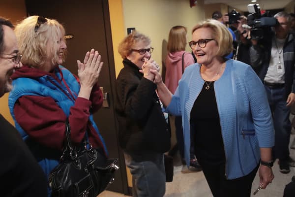 Senator Claire McCaskill (D-MO) is greeted by people waitng to vote as she leaves the polling station after voting on November 6, 2018 in Kirkwood, Missouri. 