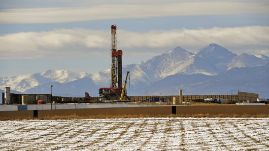 A large fracking operation becomes a new part of the horizon with Mount Meeker and Longs Peak looming in the background on December 28, 2017 in Loveland, Colorado. 