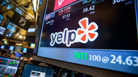 Yelp Inc. signage is displayed on a monitor on the floor of the New York Stock Exchange (NYSE) in New York.