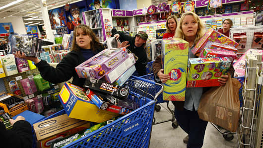 Shoppers wait in line while shopping at Toys'R'Us during the Black Friday sales event on November 27, 2009 in Fort Worth, Texas
