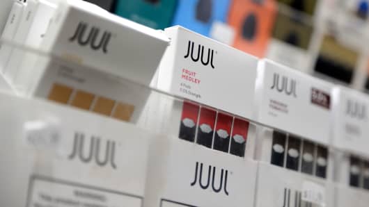 Juul products are displayed at a smoke shop in New York, Thursday, Dec. 20, 2018.