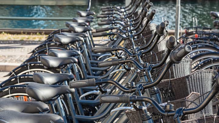 Bikes for rent at a docking station in Copenhagen, Denmark.