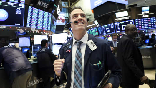 Traders work at the New York Stock Exchange in New York, the United States.