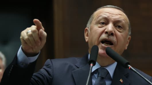 Turkey's President and leader of Turkey's ruling Justice and Development (AK) Party Recep Tayyip Erdogan makes a speech during his party's parliamentary group meeting at the Grand National Assembly of Turkey in Ankara on January 8, 2019.