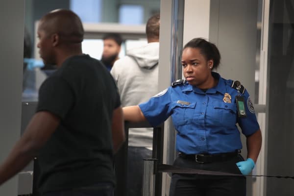 A Transportation Security Administration (TSA) worker screens passengers and airport employees at O'Hare International Airport on January 07, 2019 in Chicago, Illinois.