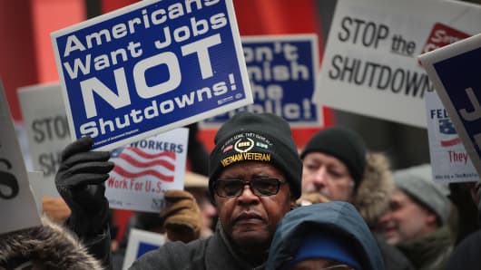 Government workers protest the government shutdown during a demonstration in the Federal Building Plaza on Jan. 10, 2019 in Chicago, Illinois.