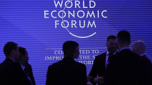 Workers listen during a briefing inside the Congress Center, the venue for the World Economic Forum (WEF), in Davos, Switzerland, on Sunday, Jan. 20, 2019.