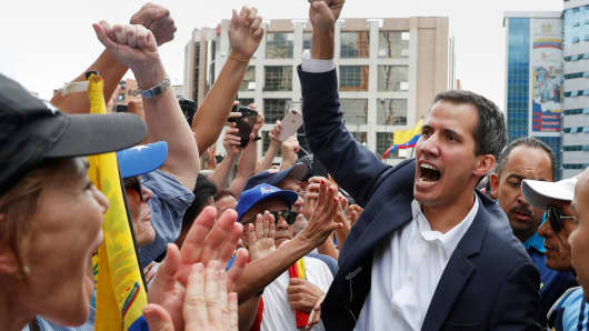 Juan Guaido, President of Venezuela's National Assembly, reacts during a rally against Venezuelan President Nicolas Maduro's government and to commemorate the 61st anniversary of the end of the dictatorship of Marcos Perez Jimenez in Caracas, Venezuela January 23, 2019.