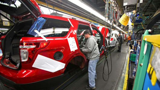 A worker assembles a 2011 Ford Motor Co. Explorer at a plant in Chicago, Illinois, U.S., on Wednesday, Dec. 1, 2010.