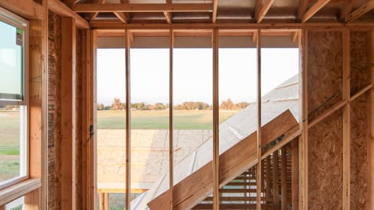 A net zero energy home under construction by De Young Properties. Adding solar panels to a roof will not alone get a house to net zero energy. Choices in the framing and window design are part of required energy-efficiency upgrades.